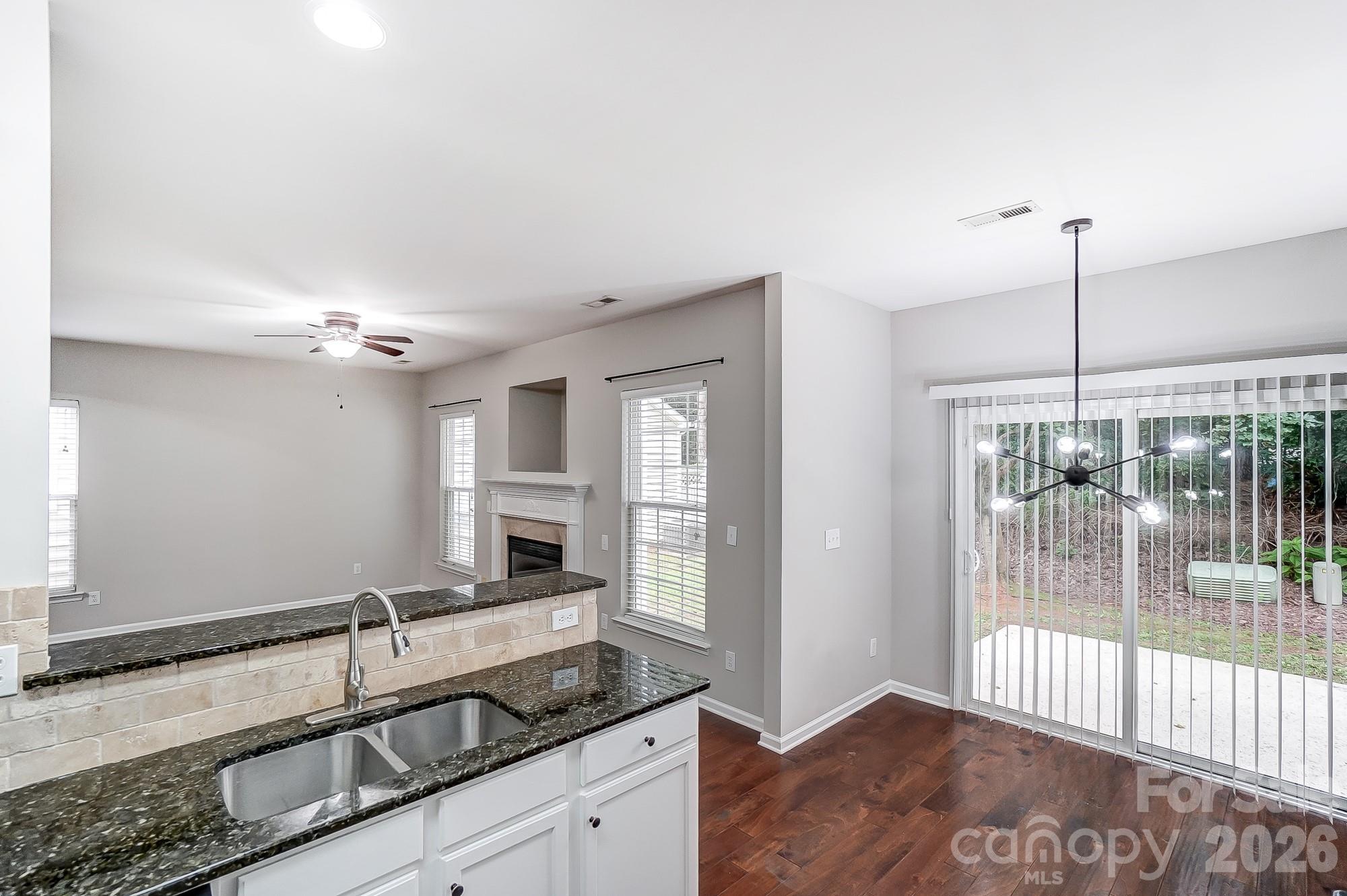 4914 Sunset Ridge Court Charlotte, NC 28269 - Photo 15 of 48 a view of a kitchen from a windows and a chandelier