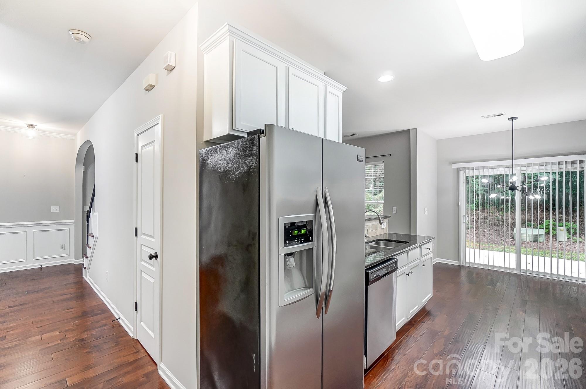 4914 Sunset Ridge Court Charlotte, NC 28269 - Photo 18 of 48 a kitchen with stainless steel appliances a refrigerator a stove a sink and a refrigerator
