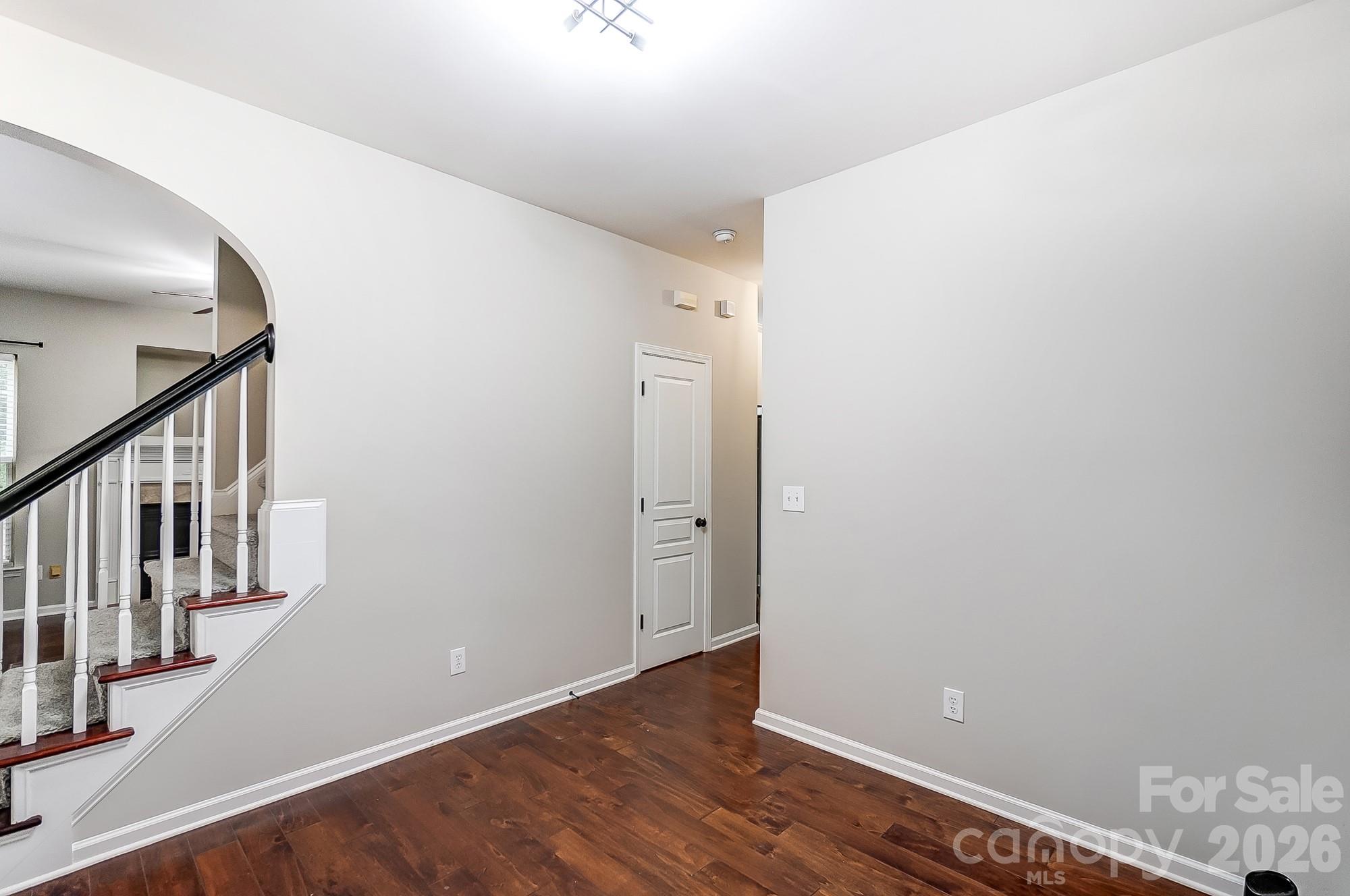 4914 Sunset Ridge Court Charlotte, NC 28269 - Photo 21 of 48 a view of an empty room with wooden floor