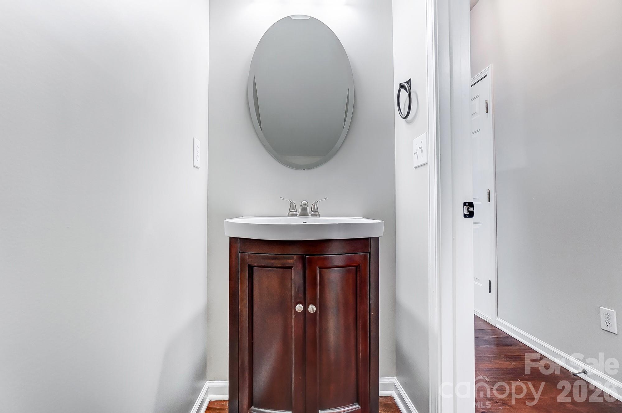 4914 Sunset Ridge Court Charlotte, NC 28269 - Photo 23 of 48 a bathroom with a sink and a mirror