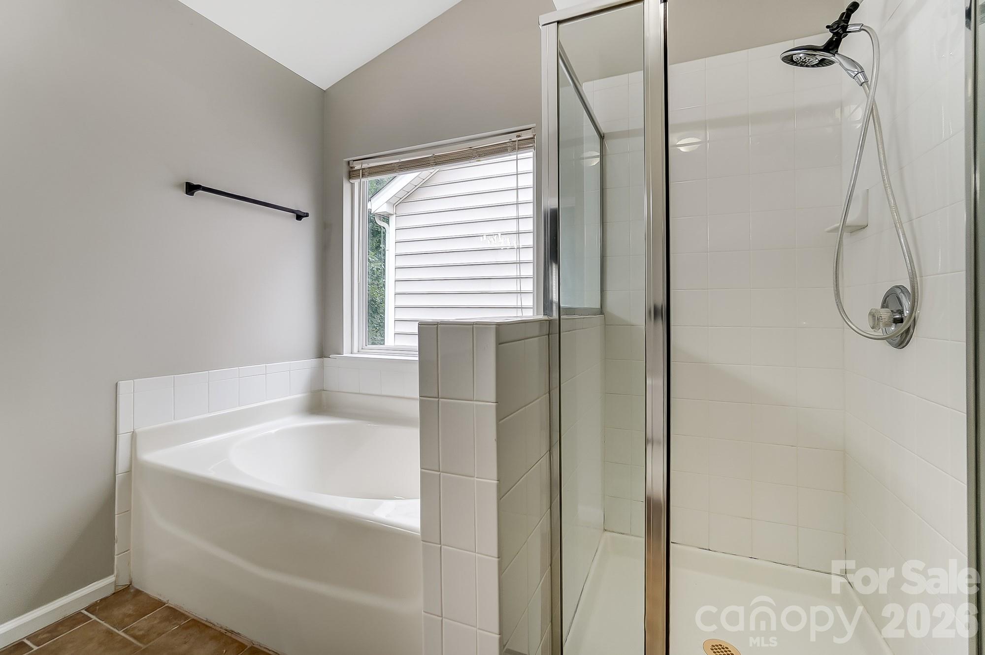 4914 Sunset Ridge Court Charlotte, NC 28269 - Photo 31 of 48 a bathroom with a bathtub and shower