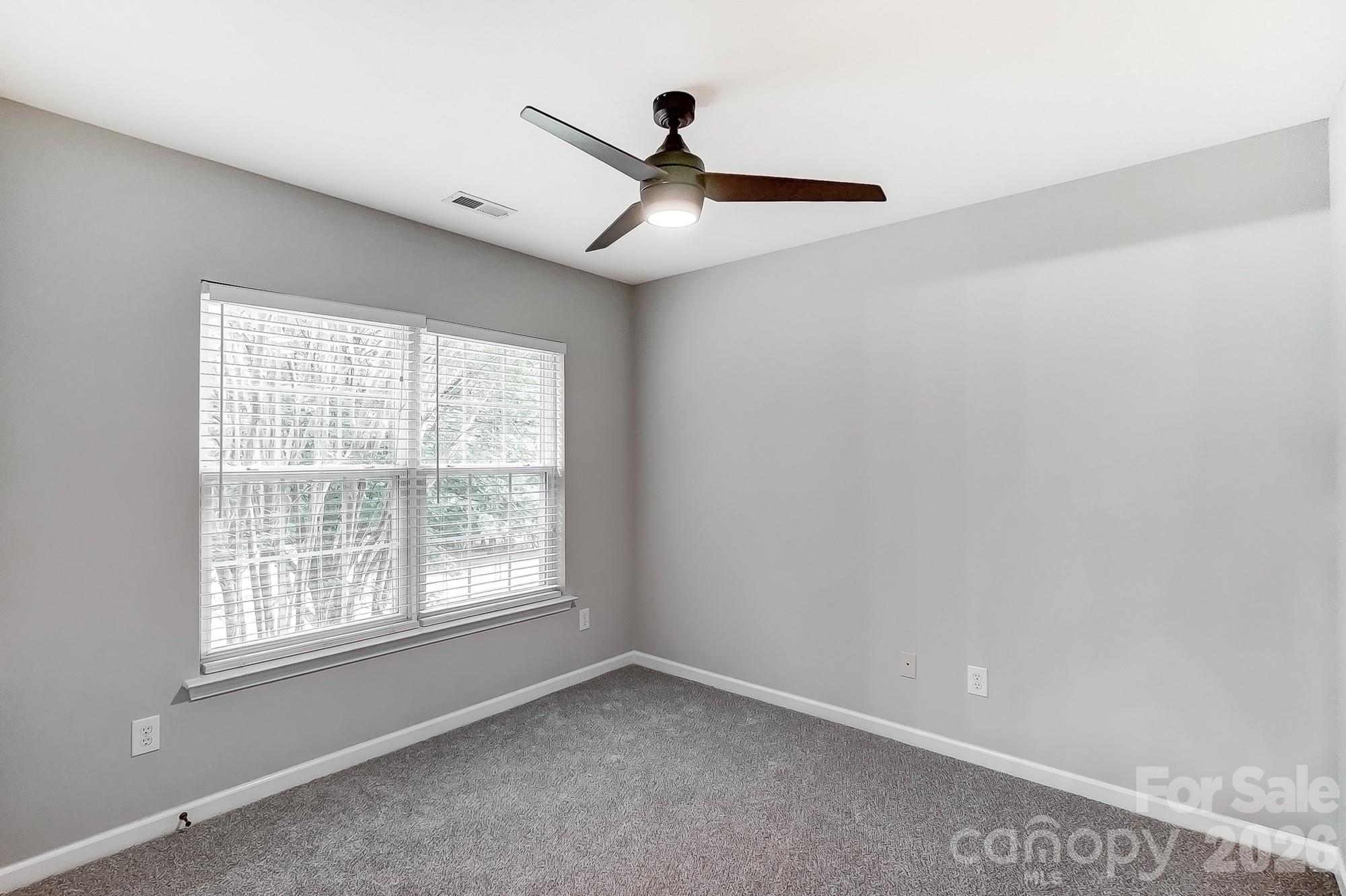 4914 Sunset Ridge Court Charlotte, NC 28269 - Photo 39 of 48 a view of an empty room with a window