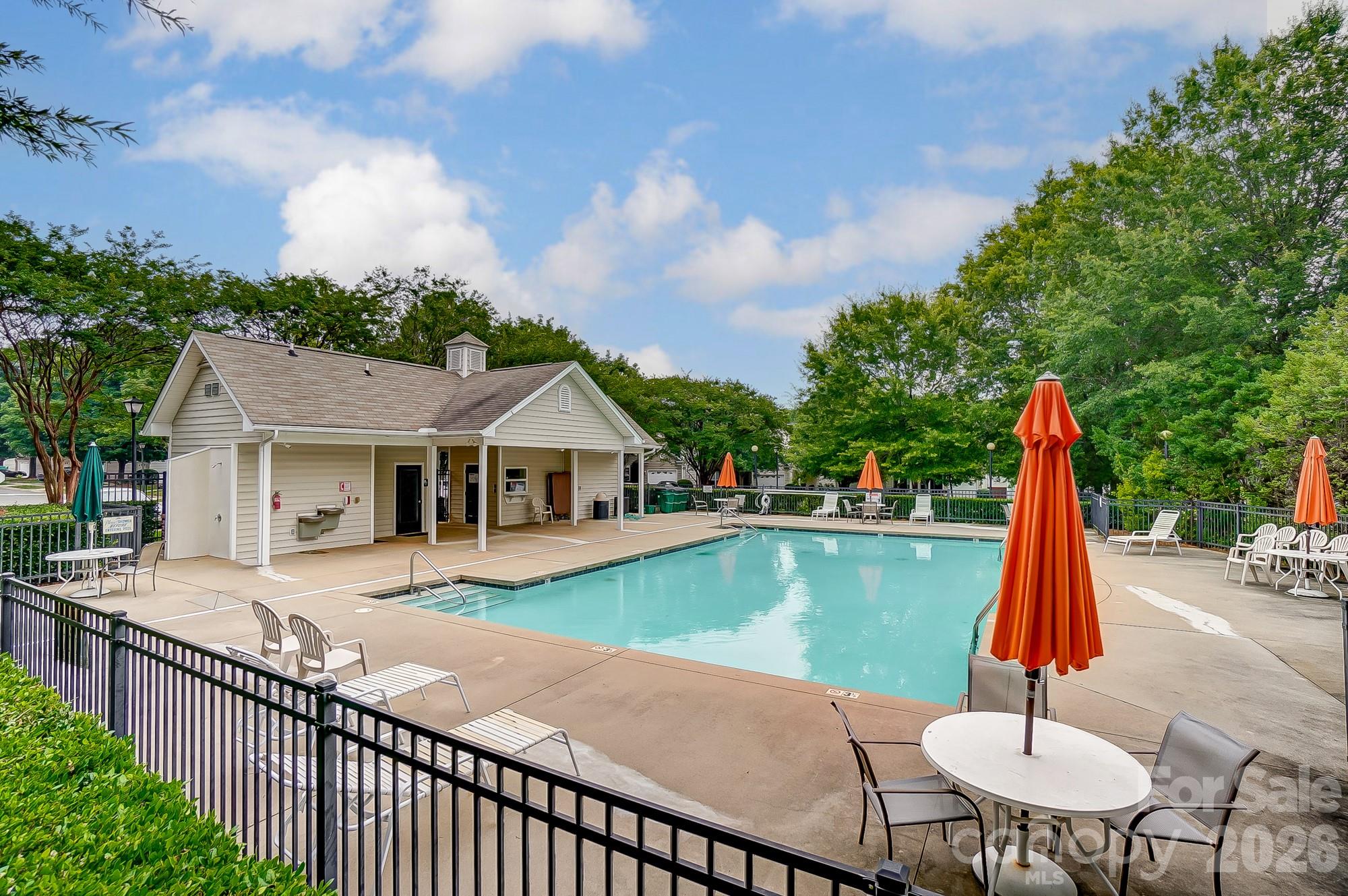 4914 Sunset Ridge Court Charlotte, NC 28269 - Photo 46 of 48 a view of a house with swimming pool and sitting area