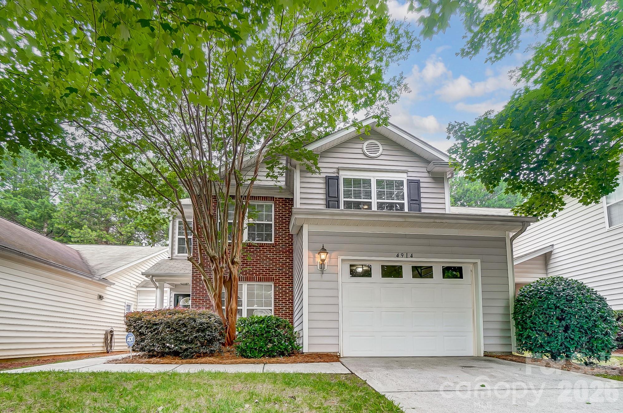 4914 Sunset Ridge Court Charlotte, NC 28269 - Photo 47 of 48 a front view of a house with a garden