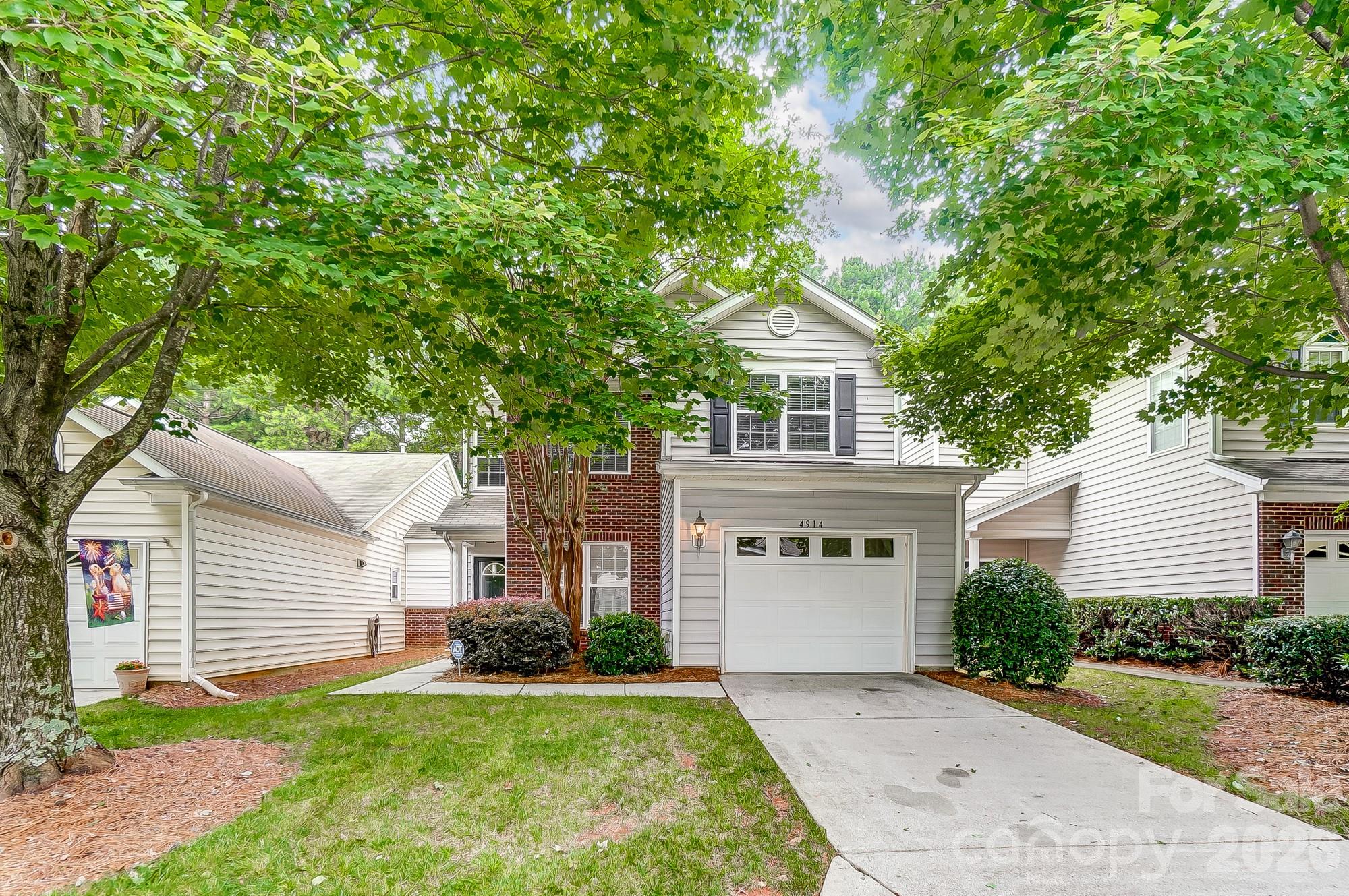 4914 Sunset Ridge Court Charlotte, NC 28269 - Photo 48 of 48 a view of house with a yard and potted plants