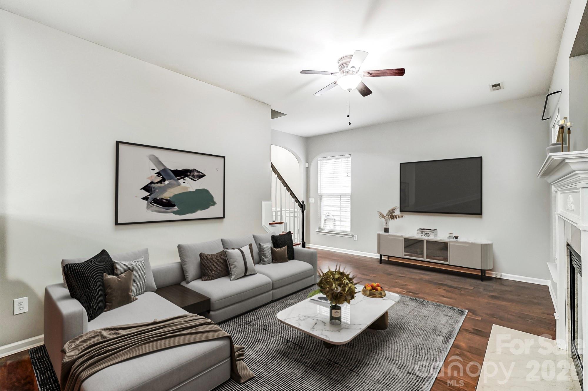 4914 Sunset Ridge Court Charlotte, NC 28269 - Photo 6 of 48 a living room with furniture and a flat screen tv