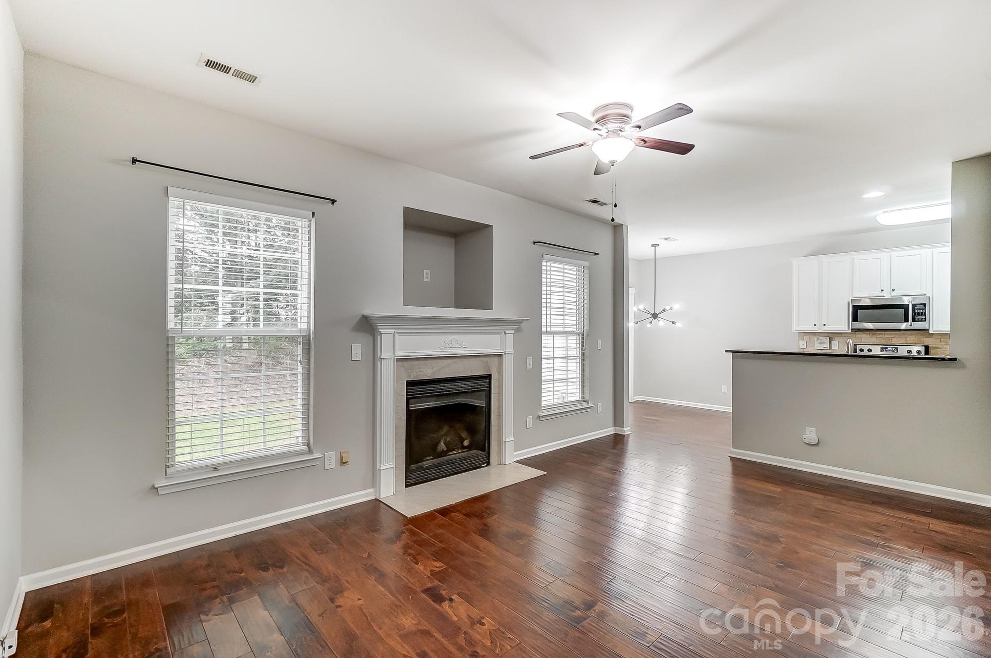 4914 Sunset Ridge Court Charlotte, NC 28269 - Photo 10 of 48 a view of an empty room with kitchen and a window