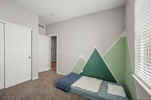 a view of a bedroom with windows