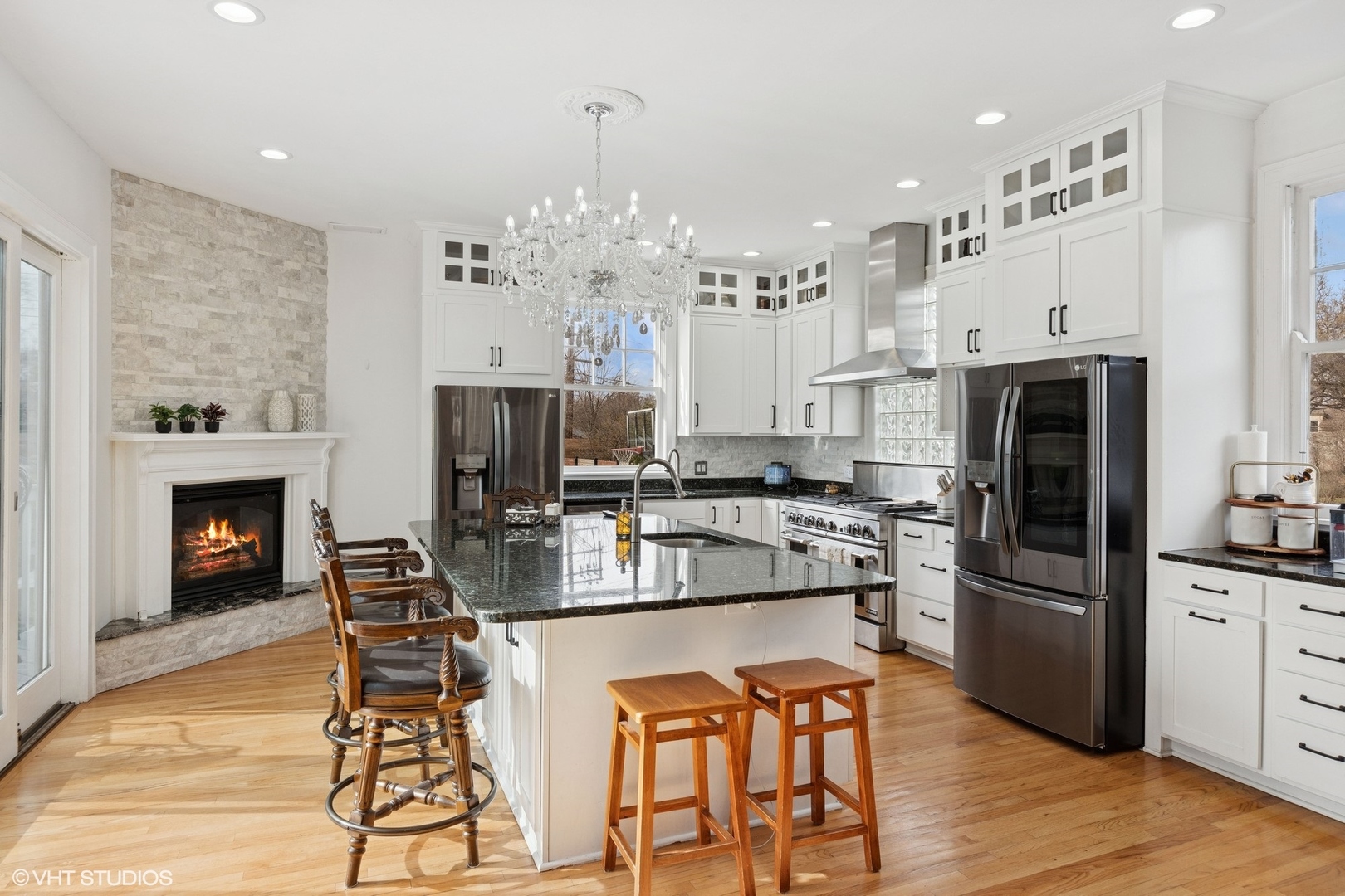 130 Michaux Road Riverside, IL 60546 - Photo 11 of 45 a kitchen with stainless steel appliances a dining table chairs stove and refrigerator