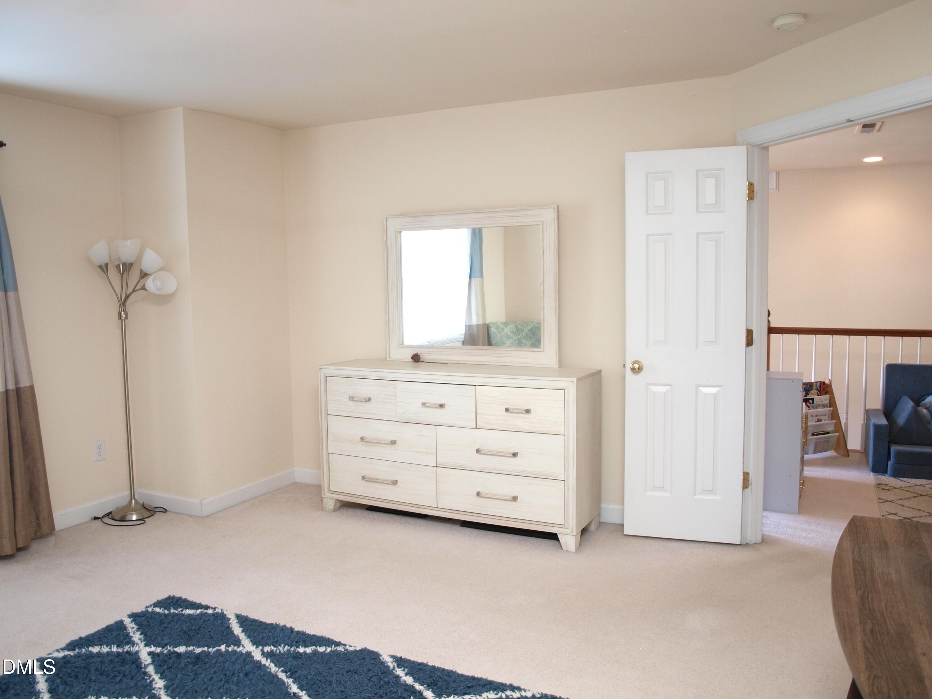 5206 Rio Grande Drive Raleigh, NC 27616 - Photo 22 of 37 a room with a dresser and a window