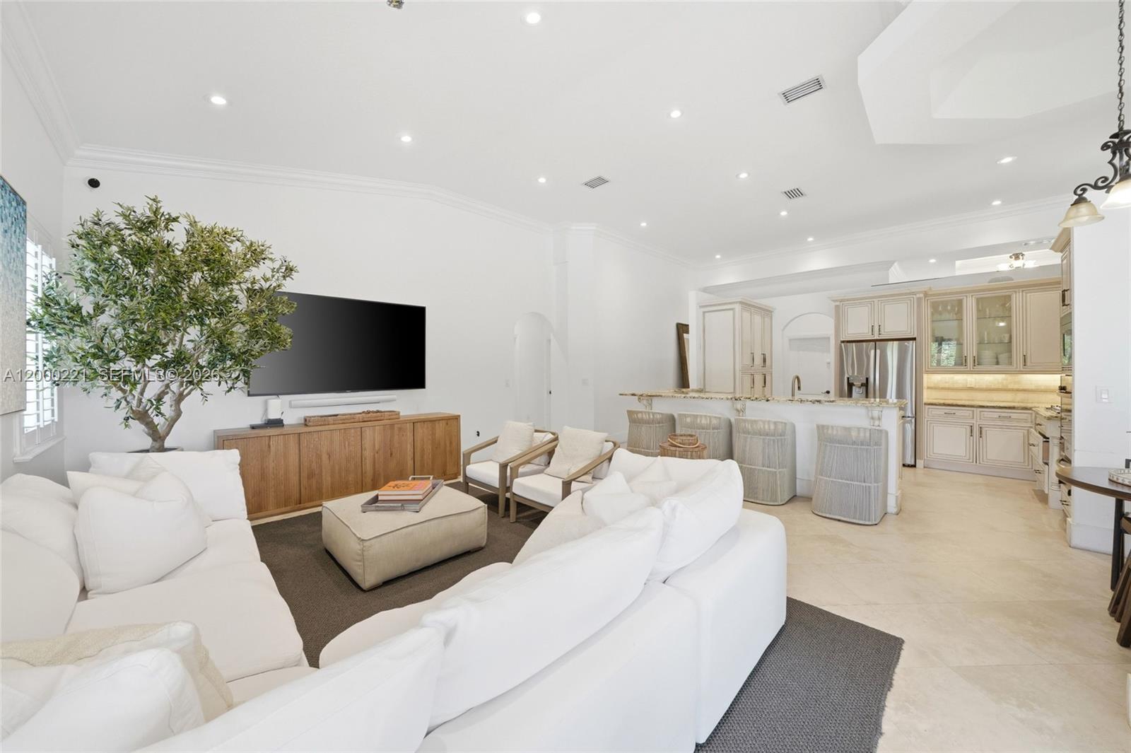 9901 Southwest 145th Street Miami, FL 33176 - Photo 21 of 78 a living room with furniture and a flat screen tv