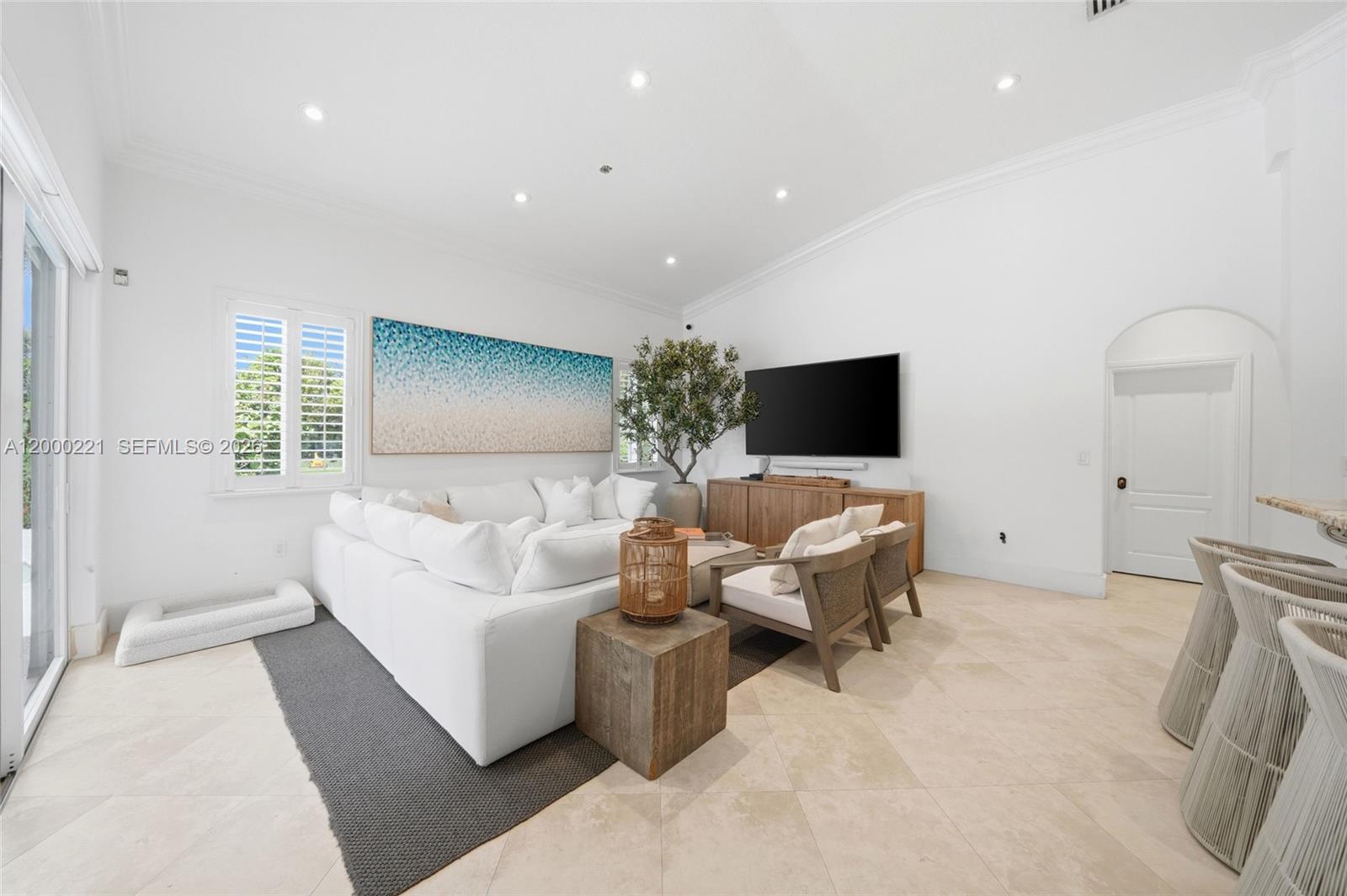 9901 Southwest 145th Street Miami, FL 33176 - Photo 22 of 78 a living room with furniture and a flat screen tv
