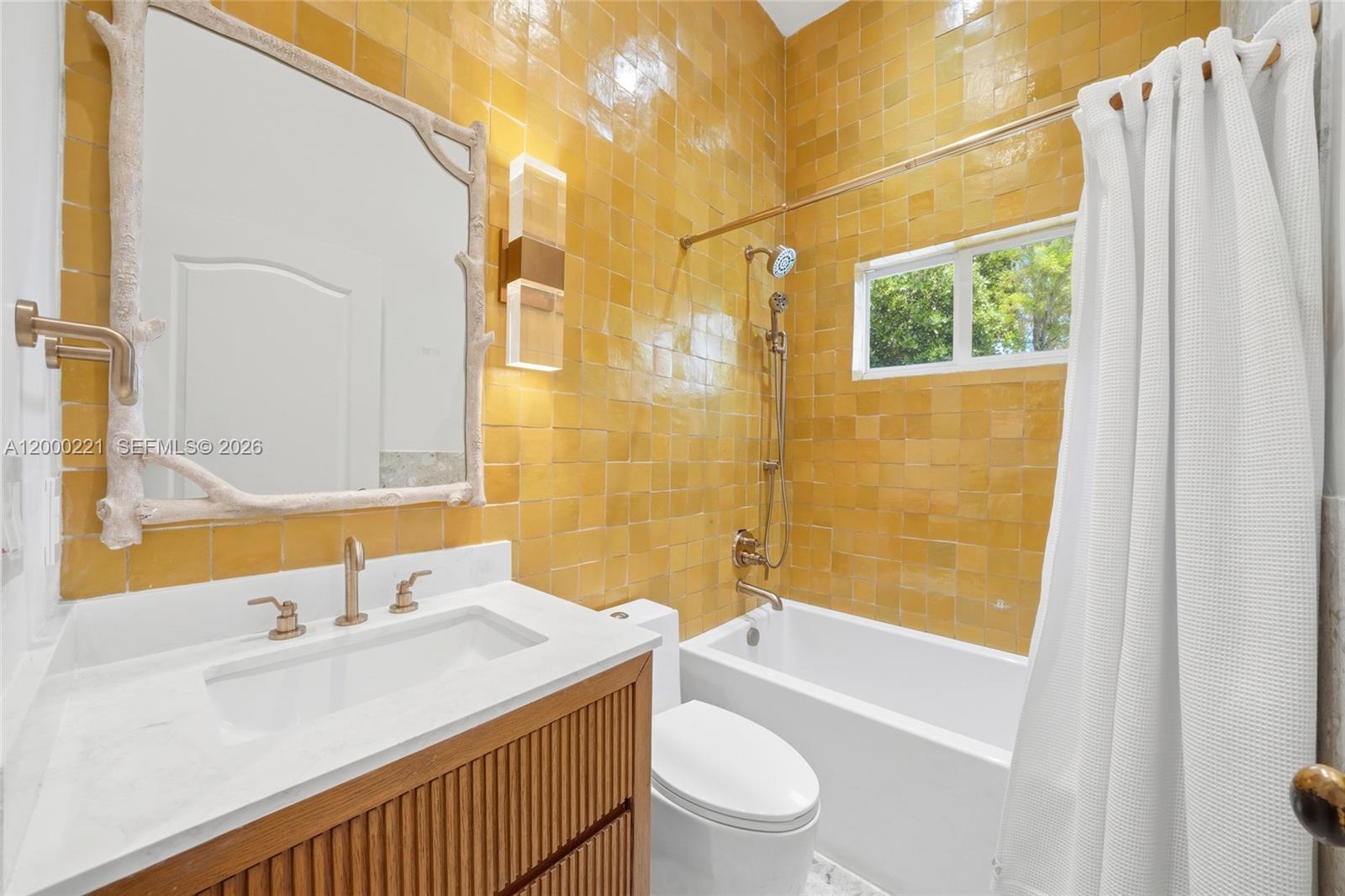 9901 Southwest 145th Street Miami, FL 33176 - Photo 33 of 78 a bathroom with a sink a toilet and shower