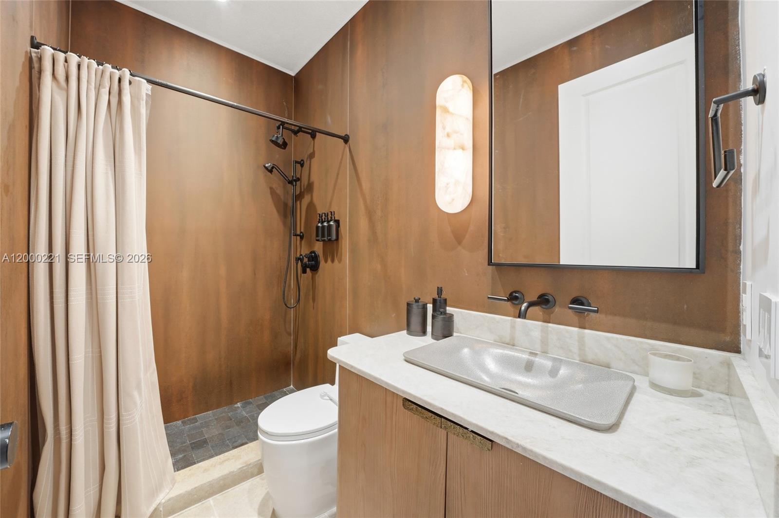 9901 Southwest 145th Street Miami, FL 33176 - Photo 35 of 78 a bathroom with a granite countertop sink toilet and shower