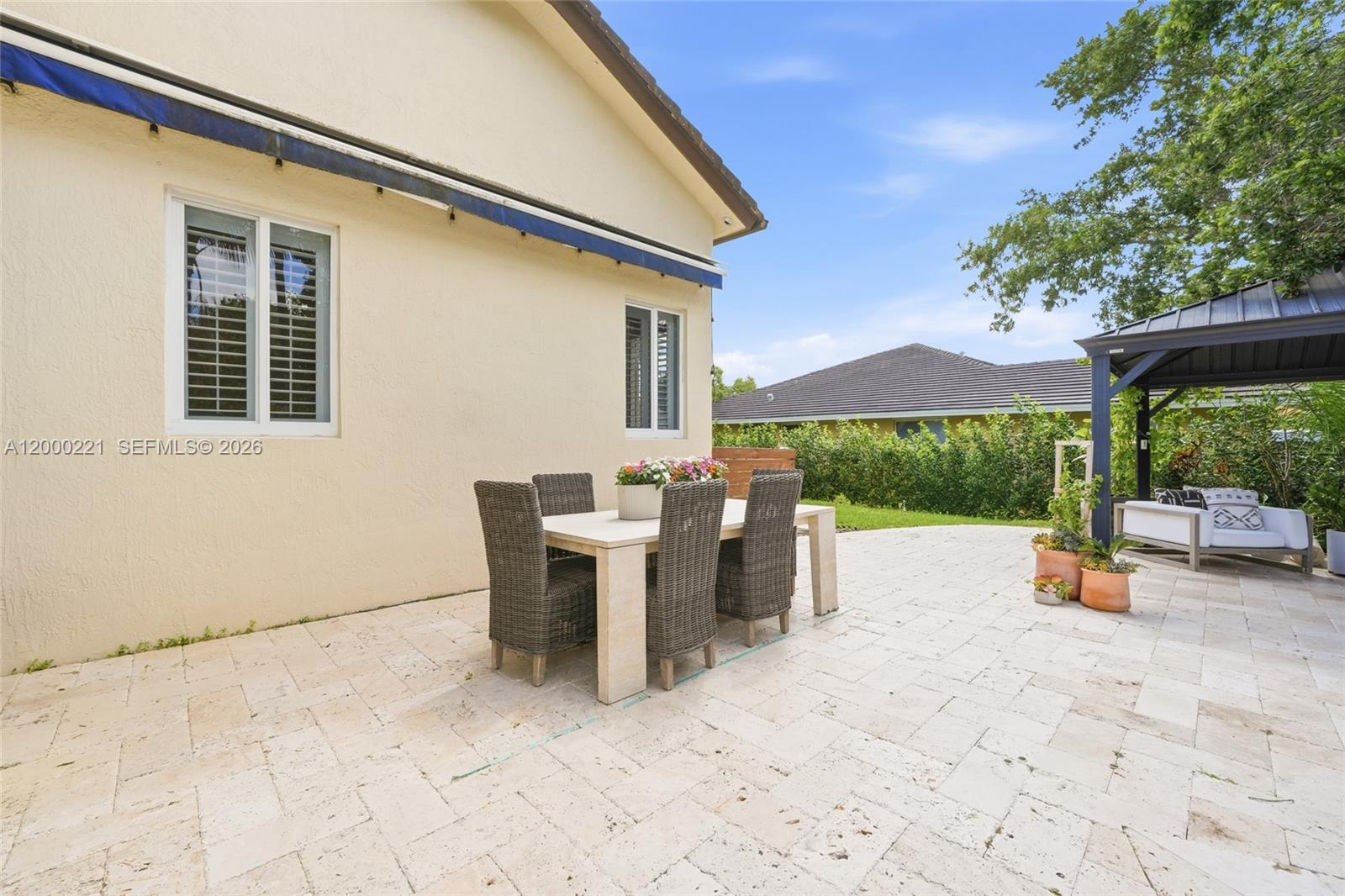 9901 Southwest 145th Street Miami, FL 33176 - Photo 40 of 78 a view of a patio with a backyard