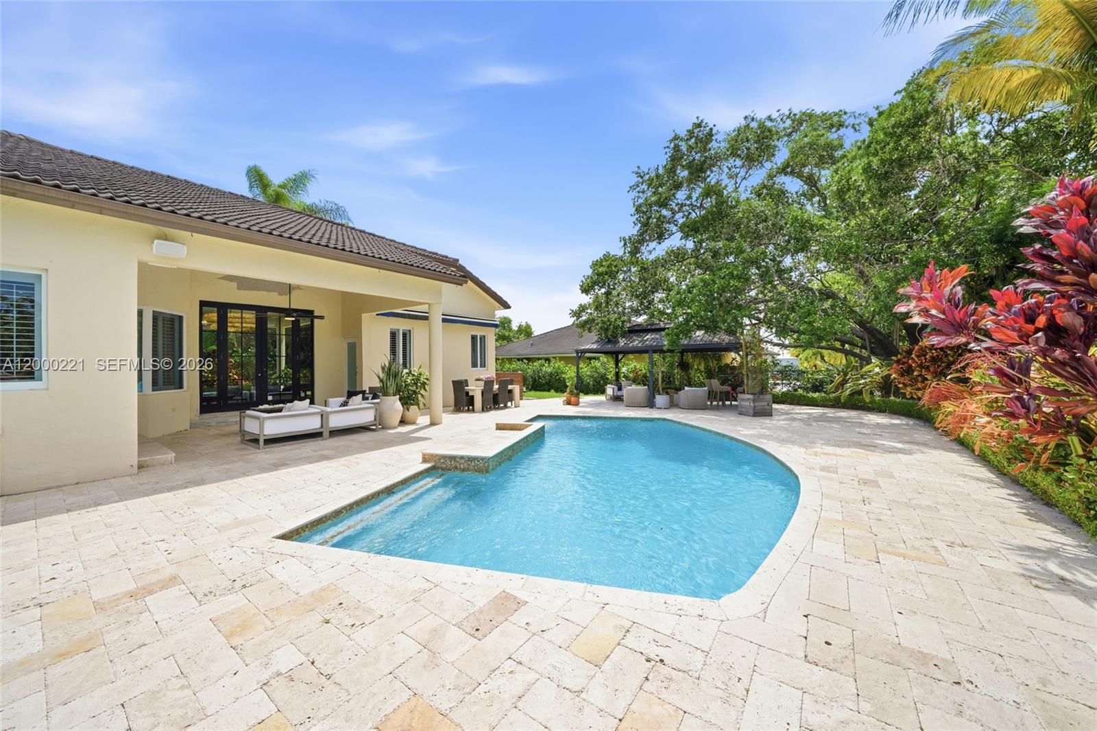 9901 Southwest 145th Street Miami, FL 33176 - Photo 44 of 78 a view of a house with swimming pool and sitting area