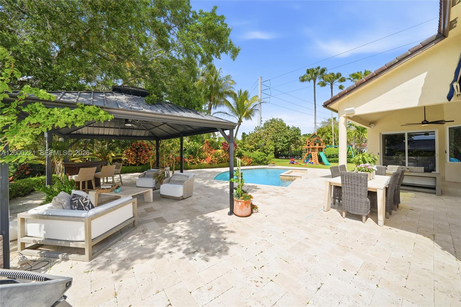 9901 Southwest 145th Street Miami, FL 33176 - Photo 47 of 78 a view of a patio with swimming pool