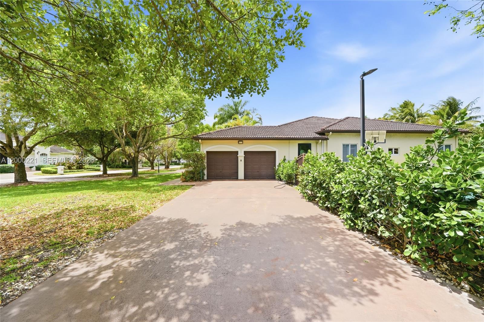 9901 Southwest 145th Street Miami, FL 33176 - Photo 5 of 78 a house view with a garden space