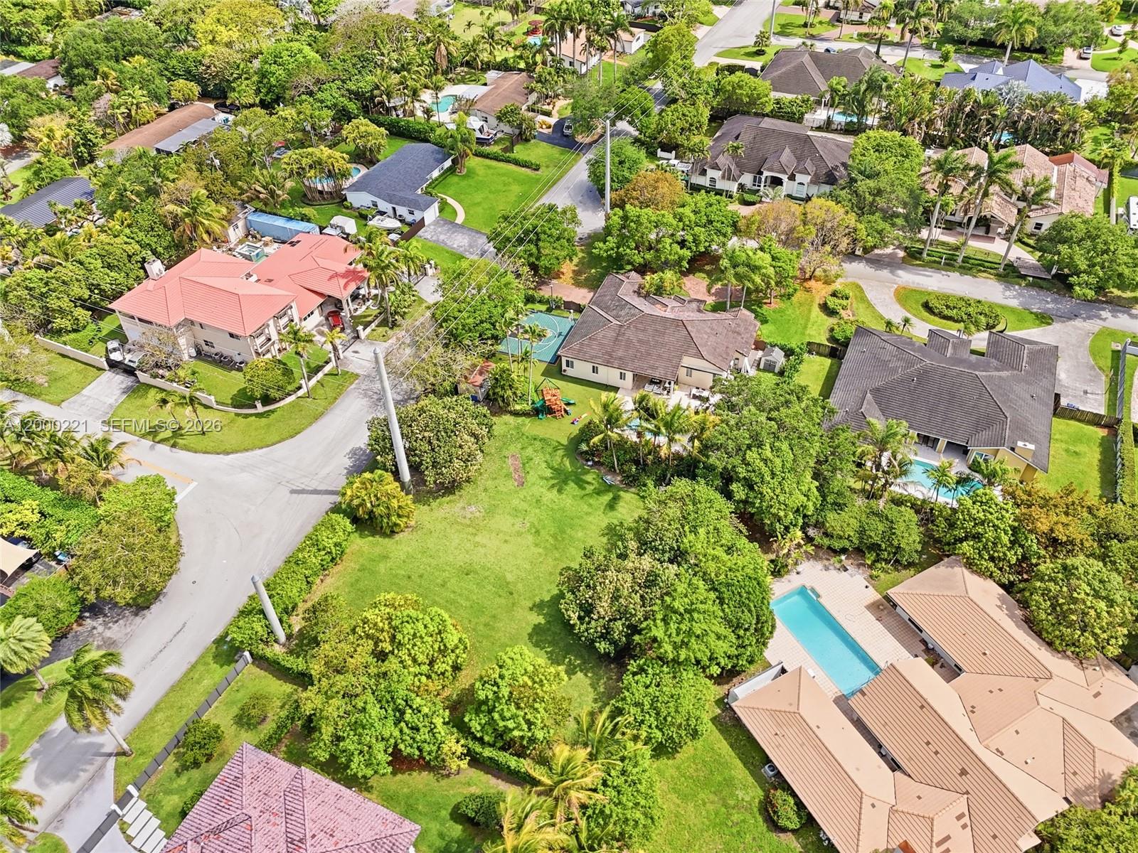 9901 Southwest 145th Street Miami, FL 33176 - Photo 62 of 78 an aerial view of residential house with outdoor space and trees all around