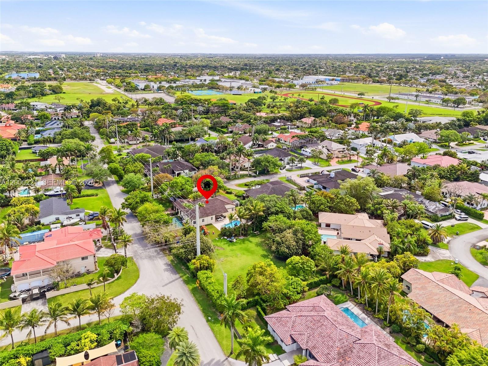9901 Southwest 145th Street Miami, FL 33176 - Photo 70 of 78 an aerial view of residential houses with outdoor space
