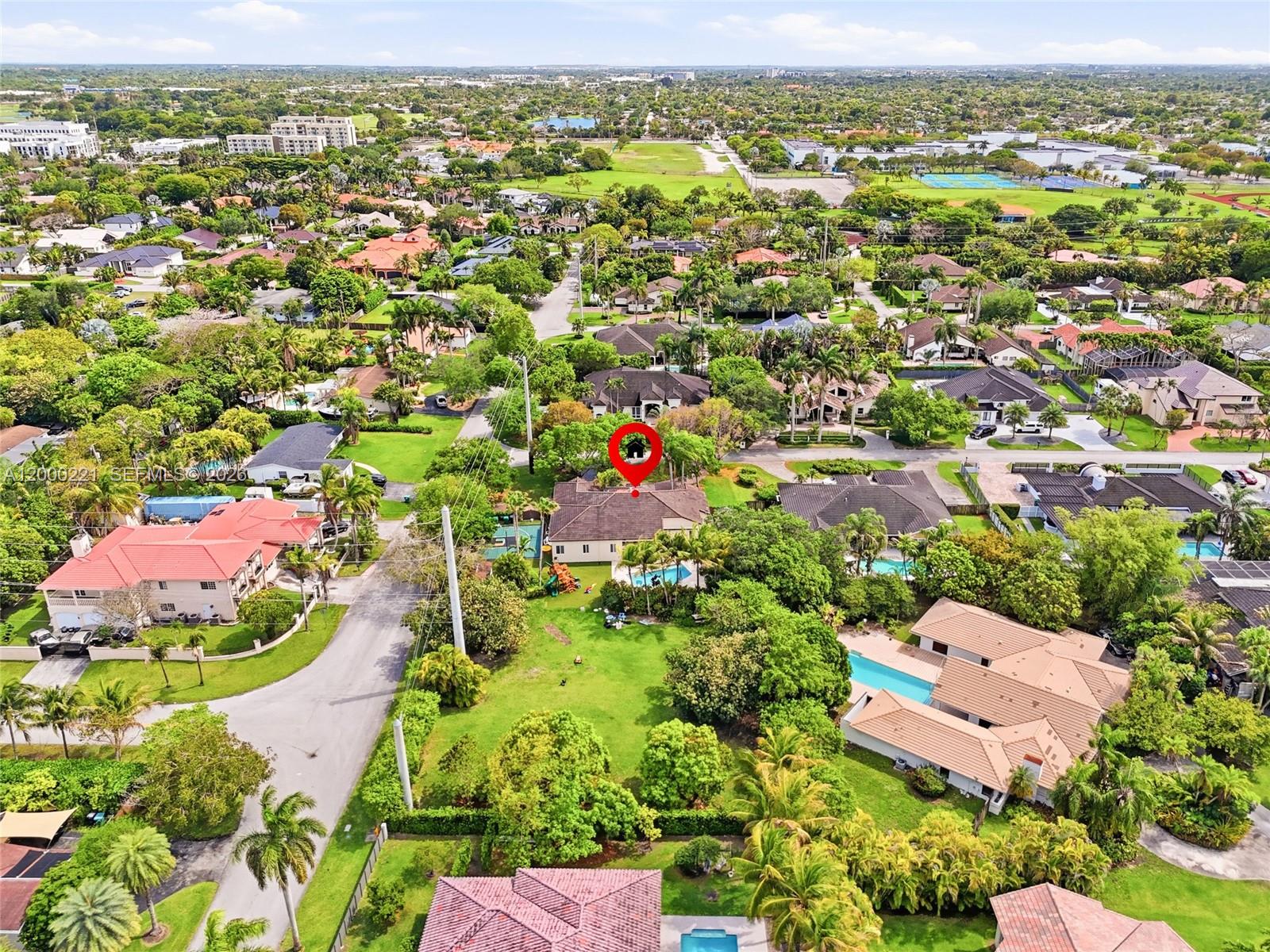 9901 Southwest 145th Street Miami, FL 33176 - Photo 77 of 78 an aerial view of residential houses with outdoor space and trees