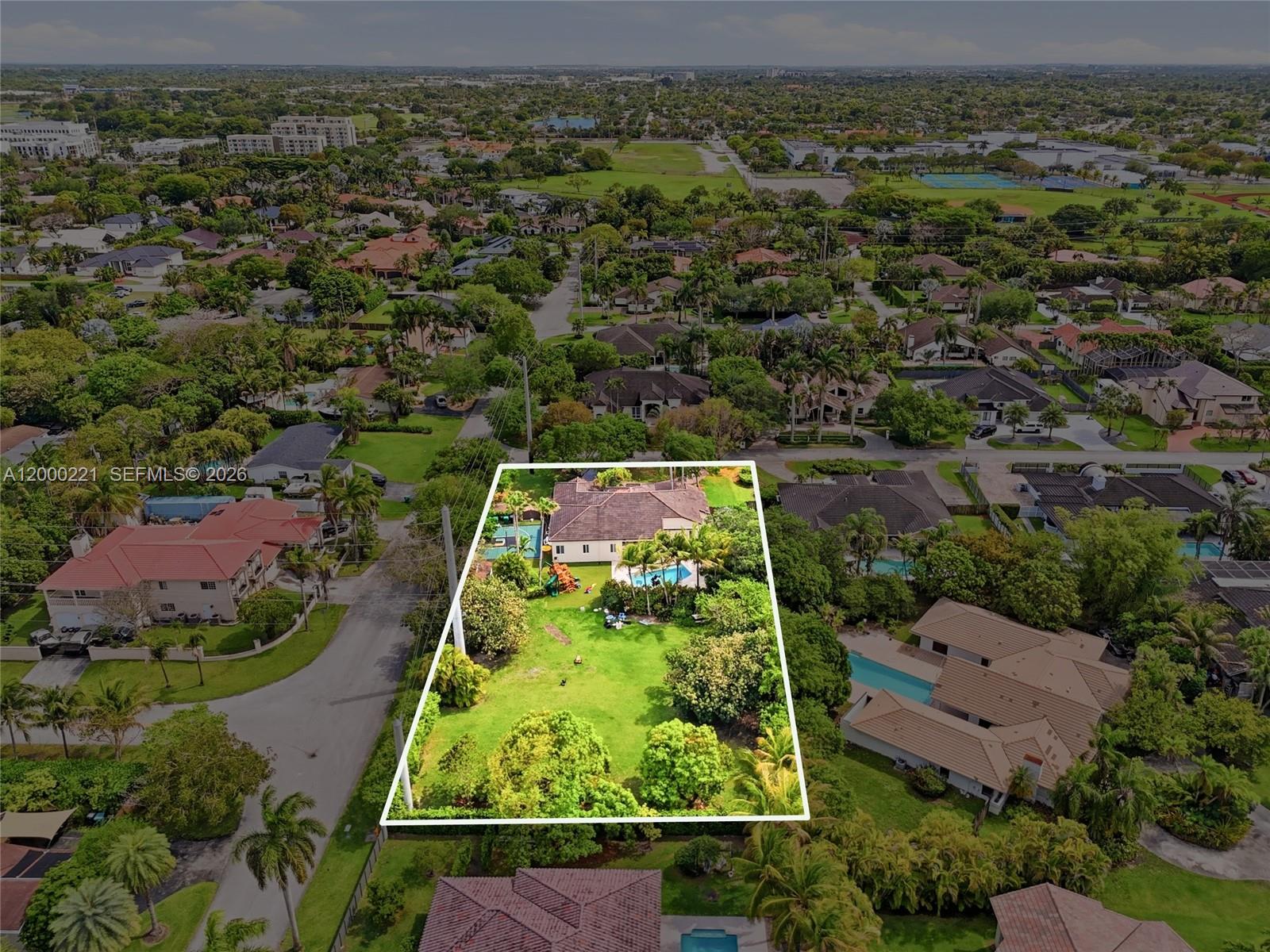 9901 Southwest 145th Street Miami, FL 33176 - Photo 78 of 78 an aerial view of residential houses with outdoor space and garden