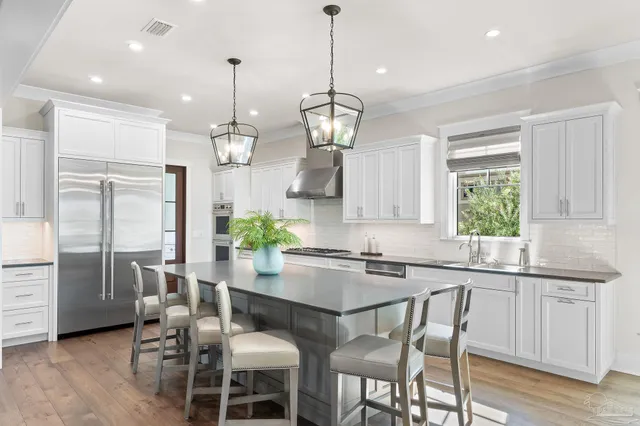 a bedroom with a large bed couch and a window