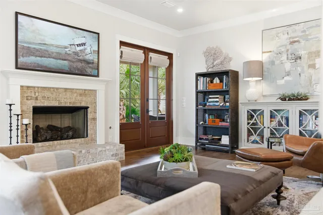 an aerial view of a city with lots of residential buildings ocean and mountain view in back