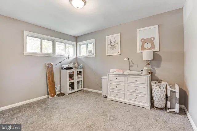 a view of a bedroom with cabinet cabinet and window