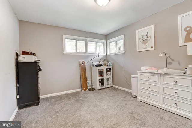 a view of a bedroom with cabinet