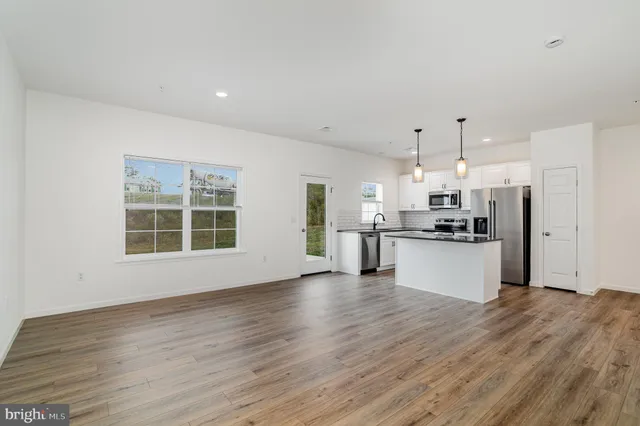a view of kitchen with wooden floor