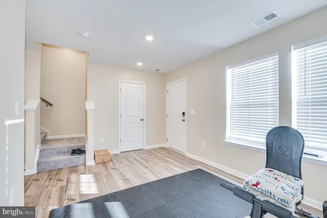 a room with a window and furniture