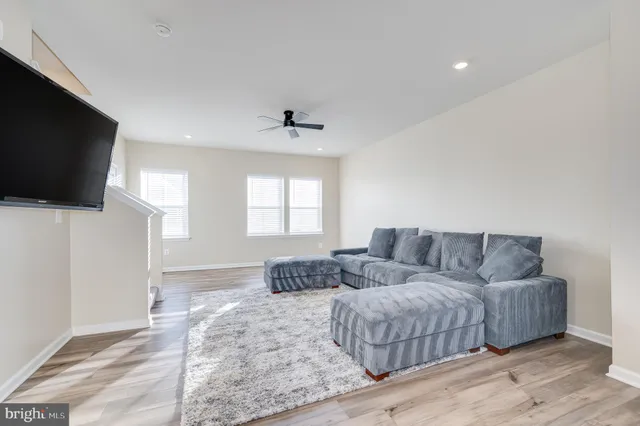 a spacious bedroom with a large bed and a flat screen tv