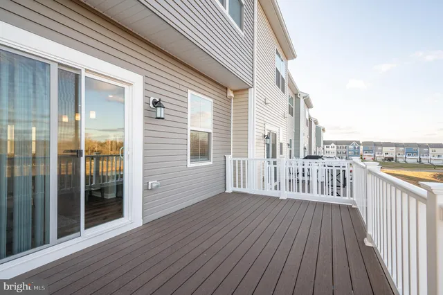 a view of a balcony with wooden floor