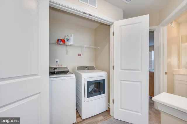 a bed sitting in a bedroom and closet