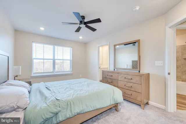 a bathroom with a shower sink and mirror
