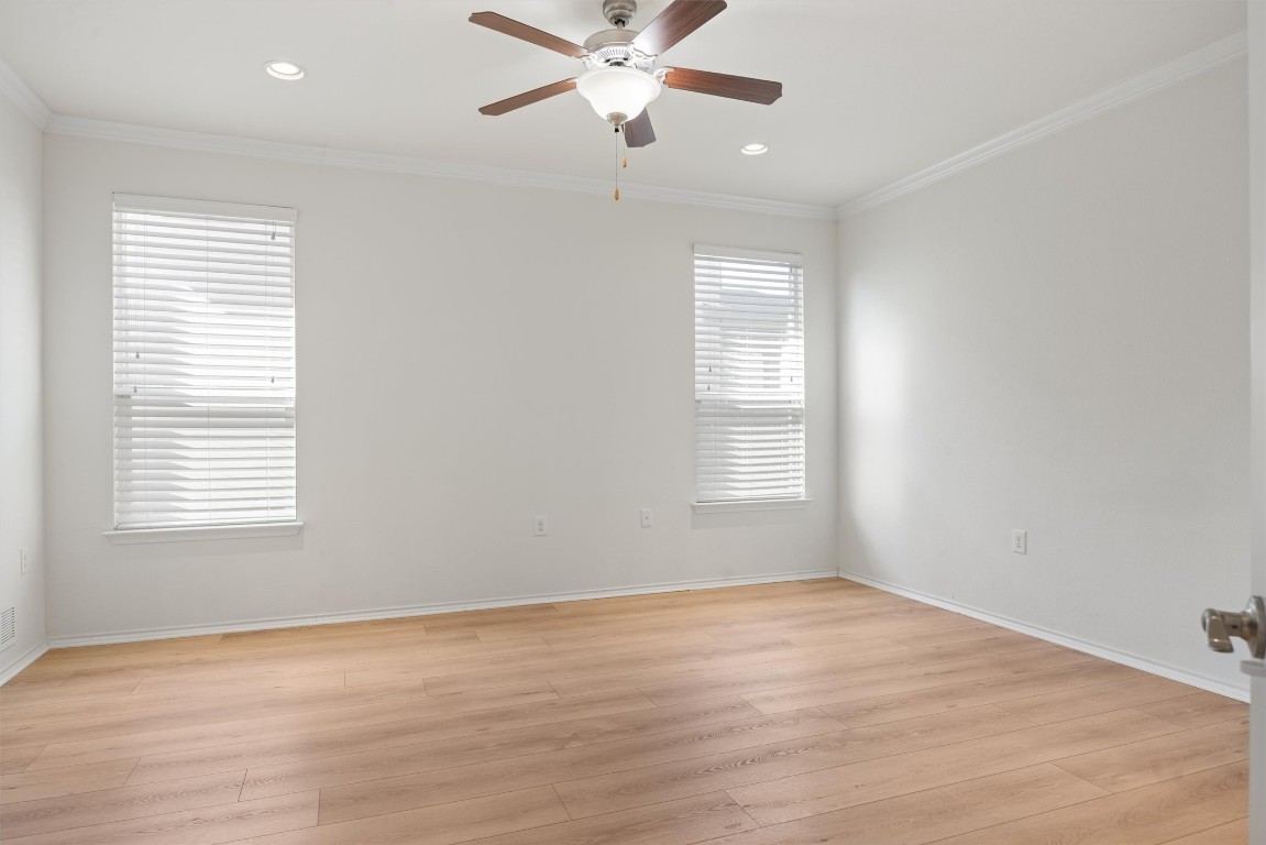 9100 Winter Haven Road Austin, TX 78747 - Photo 12 of 31 wooden floor in an empty room with a window