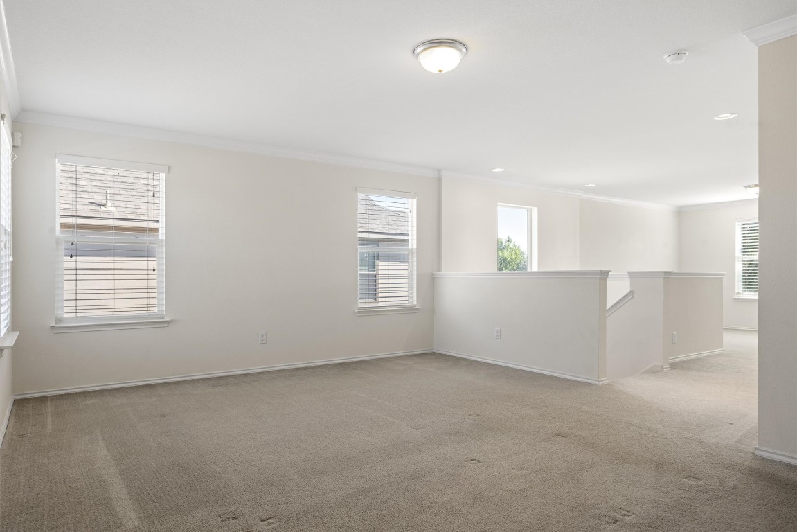 9100 Winter Haven Road Austin, TX 78747 - Photo 17 of 31 an empty room with windows