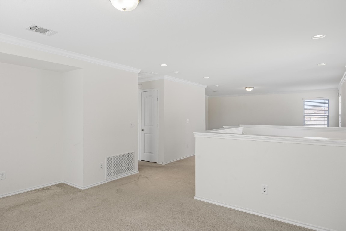 9100 Winter Haven Road Austin, TX 78747 - Photo 19 of 31 a view of a kitchen with refrigerator and white wall