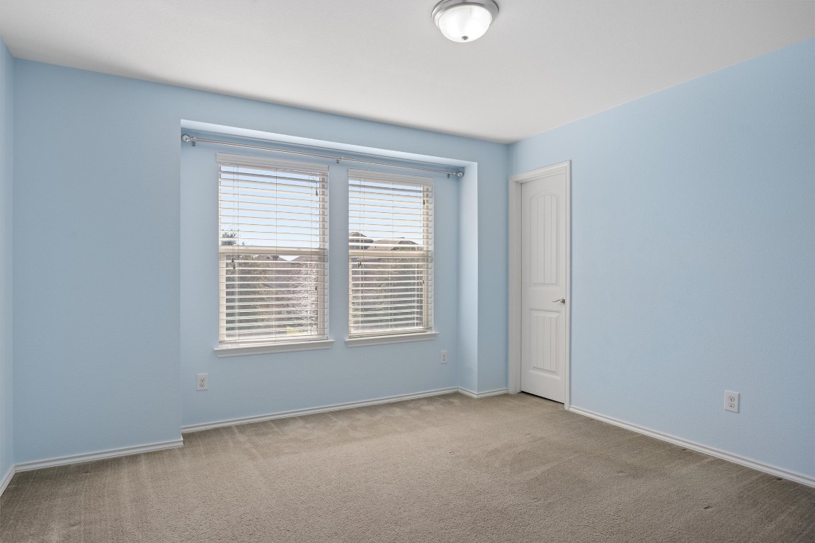 9100 Winter Haven Road Austin, TX 78747 - Photo 20 of 31 a view of an empty room with a window