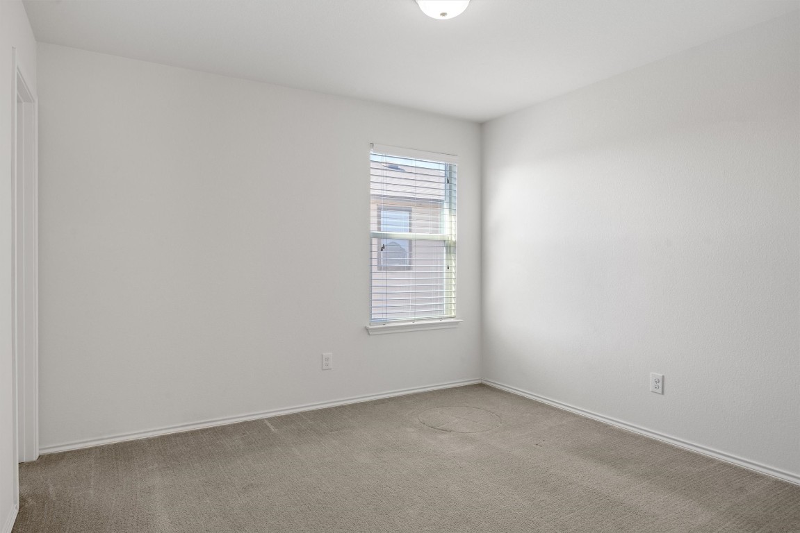 9100 Winter Haven Road Austin, TX 78747 - Photo 22 of 31 a view of an empty room with a window