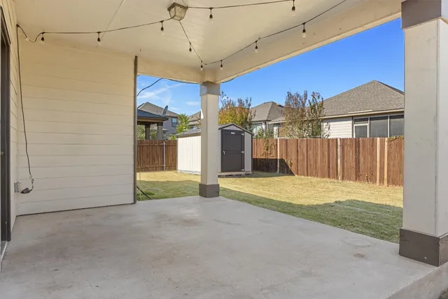 a view of a backyard of a house