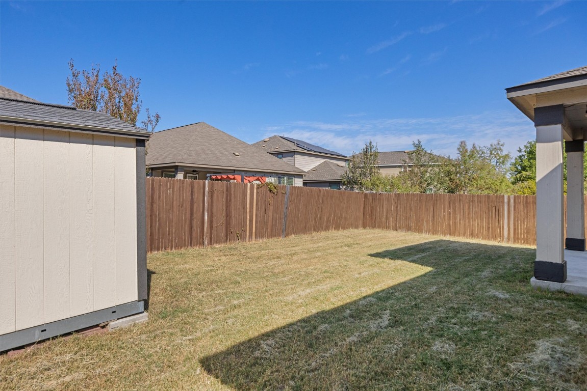 9100 Winter Haven Road Austin, TX 78747 - Photo 30 of 31 a view of backyard with a small cabin