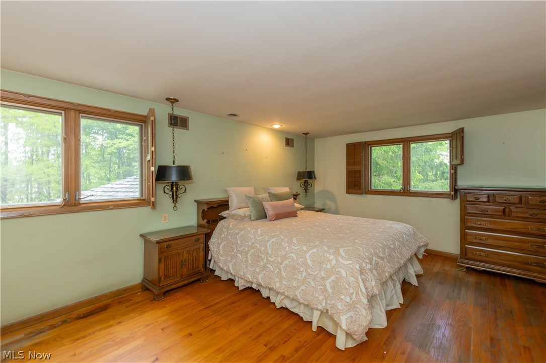 25001 Letchworth Road Beachwood, OH 44122 - Photo 24 of 50 Hardwood flooring throughout featuring natural wood window frames and matching shutters