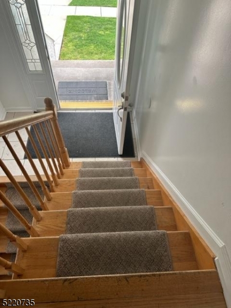 720 Walnut Street Linden, NJ 07036 - Photo 3 of 18 a view of staircase with large window