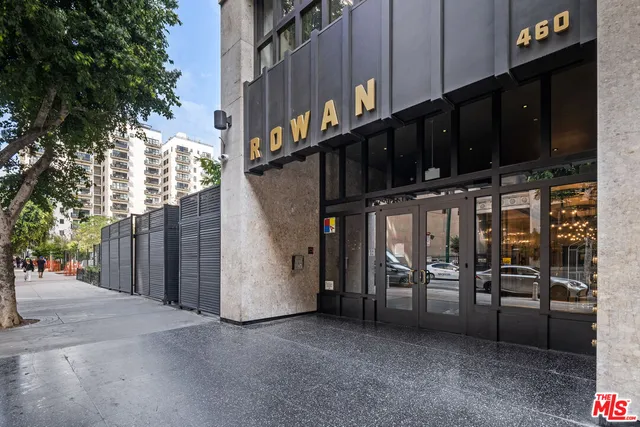 a view of a street with seating area