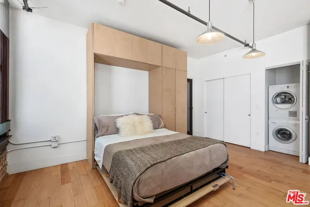 a bedroom with a bed and a table