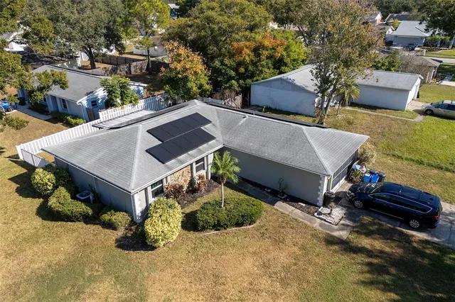 an aerial view of a house with swimming pool
