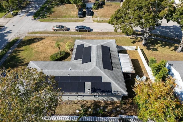 an aerial view of a house with swimming pool
