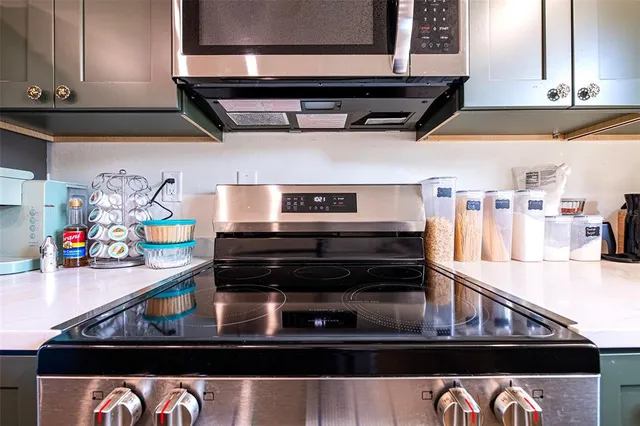a kitchen with a stove and cabinets